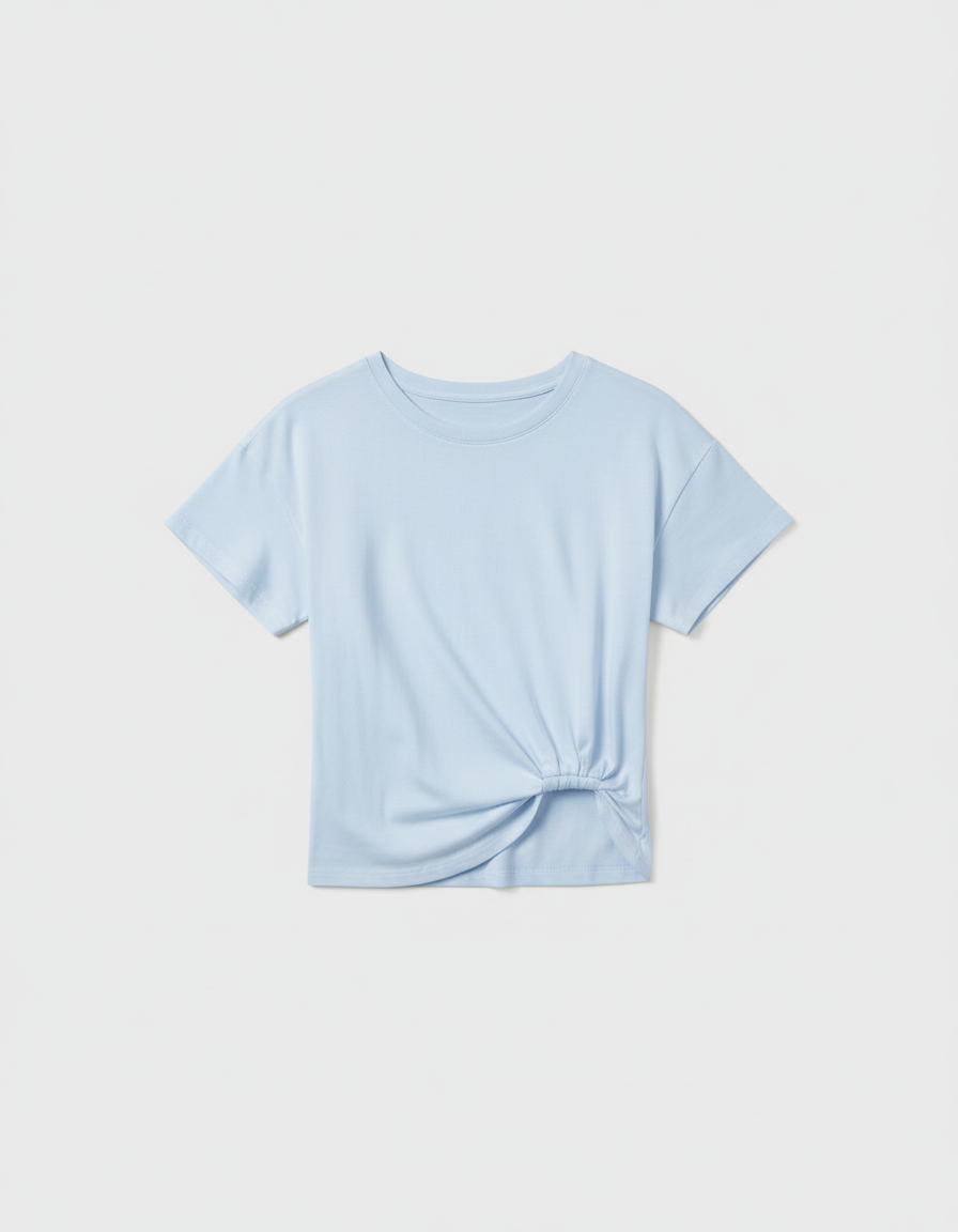 Flat lay with pale blue t-shirt on white background